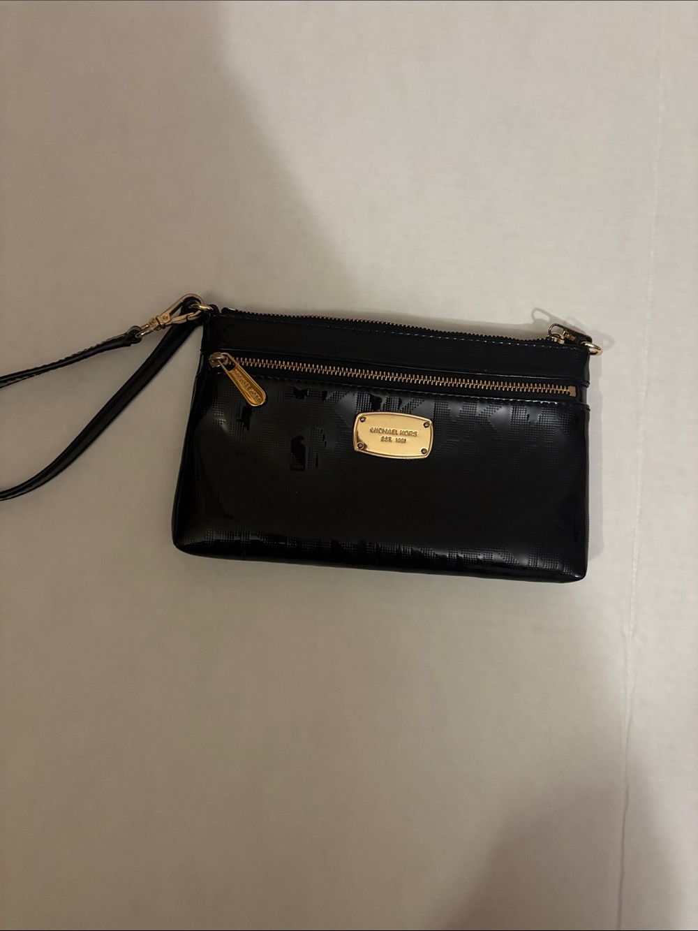 Michael Kors Black Patent Leather Wristlet with Gold Plaque